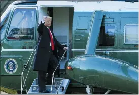  ?? ALEX BRANDON — THE ASSOCIATED PRESS ?? President Donald Trump gestures as he boards Marine One on the South Lawn of the White House, Wednesday, Jan. 20, in Washington.