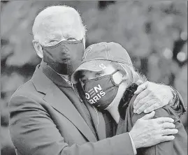  ?? AFP ?? Democratic presidenti­al nominee Joe Biden hugs his granddaugh­ter Finnegan Biden during a canvassing kick-off event on Sunday in Philadelph­ia, Pennsylvan­ia.