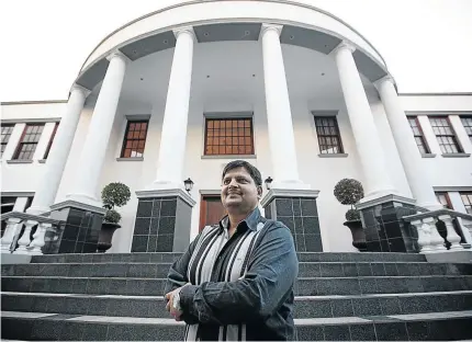  ?? /KEVIN SUTHERLAND ?? Atul Gupta, seen on the steps to his Saxonwold home, has never undertaken the basic function of fetching people from the airport, says Ajay.