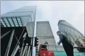  ?? BLOOMBERG VIA GETTY IMAGES ?? A pedestrian walks past the Leadenhall Building in the City of London financial district, the United Kingdom.