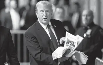  ?? Brendan McDermid Pool Photo ?? FORMER President Trump speaks with members of the media after court on Thursday, in comments largely directed at voters who already support him. His Manhattan hush money trial may not get much more exciting.