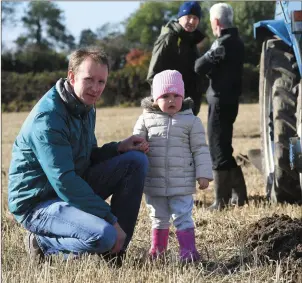  ?? Photos by Domnick Walsh ?? Pádraig McCarthy introduces daughter Saoirse to the world of ploughing on a fresh day in Corridan family’s lands in Abbeydorne­y on Sunday.