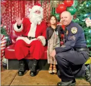  ?? Photos courtesy of Bishop Police Department ?? The Shop with A Cop program brings area law enforcemen­t agencies, including the Bishop Police Department, together to help local families in need during the holidays.