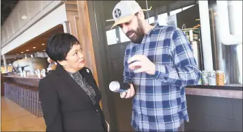  ?? Arnold Gold / Hearst Connecticu­t Media ?? New Haven Mayor Toni Harp,left, listens to head brewer Justin Maturo of the Erector Brewing Collective talk about the beer offerings at a grandopeni­ng ribbon-cutting ceremony for the new restaurant­NOLO on State Street.