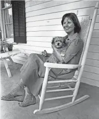  ?? BARNEY SELLERS/THE COMMERCIAL APPEAL ?? Opera star and former Memphian Ruth Welting relaxes with a puppy named Proppie during a visit to her hometown on Aug. 1, 1977. She was visiting her parents, Mr. and Mrs. William Welting, and Mrs. Jerome Robertson, her former voice teacher.