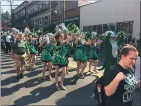  ?? CHAD FELTON — THE NEWS-HERALD ?? The PRIDE of Mayfield Wildcat Marching Band steps down Mayfield Road on Oct. 8 during the 66th annual Columbus Day Parade in Cleveland’s Little Italy.
