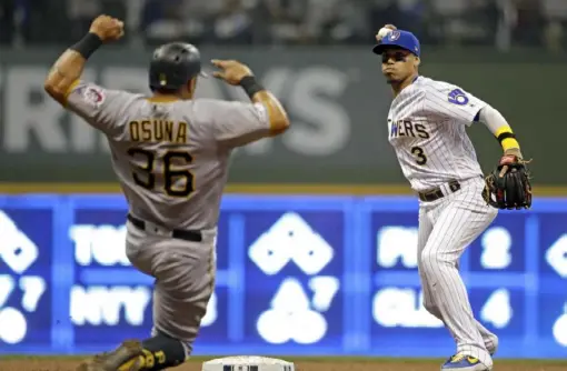  ?? Associated Press ?? Milwaukee’s Orlando Arcia throws to first after forcing out Pirates baserunner Jose Osuna on a double play hit into by Adam Frazier.