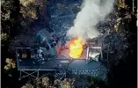  ?? IAIN MCGREGOR/ STUFF ?? Flames coming out of a ventilatio­n shaft at Pike River mine after a fourth explosion in 2010.