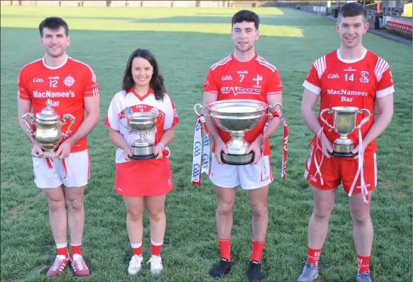  ??  ?? James Costello (left), Captain, St. Brides GFC with The Seamus Flood Cup, Caoimhe Hoey, Captain, St. Brides Camogie Club, holding the Fr. Soraghan Cup, Liam Molloy, Louth Hurling Captain with the Lory Meagher Cup and Gareth Hall, Knockbride Hurling Club Captain holding The Paddy Kelly Cup. Photo: Aidan Dullaghan/Newspics