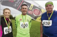  ??  ?? RIGHT: Scartaglin runners, Ami and Vincent Whooley and Owen McSweeney pictured after the An Ríocht AC 5K road race on Sunday morning. Photo by: John Reidy