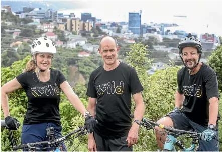  ?? KEVIN STENT/STUFF ?? Wellington region trails adviser Leasa Carlyon, Wreda chief executive Lance Walker, and Wellington Trails Trust chairman Anthony Edmonds on trails above Wellington’s Aro Valley.