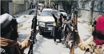  ?? THE ASSOCIATED PRESS ?? Heavily armed Taliban fighters patrol in Kabul, Afghanista­n, on Thursday.