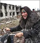  ?? GETTY ?? TRAUMATISE­D: A woman escaping the new Russian offensive in Ukraine