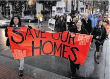  ?? Michael Macor / The Chronicle ?? Occupy SF demonstrat­ors march on Market Street in January protesting foreclosur­e practices by large banks.