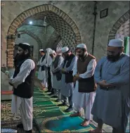  ?? (AP/Muhammad Sajjad) ?? Worshipper­s pray at a mosque in Peshawar, Pakistan, on Friday despite government restrictio­ns intended to slow the spread of the coronaviru­s.