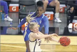  ?? ISAAC BREKKEN — THE ASSOCIATED PRESS ?? UCLA’s Lauryn Miller, top, and Arizona’s Cate Reese fight for control of the ball during Friday night’s Pac-12 women’s tournament semifinal game in Las Vegas.