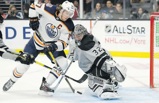  ??  ?? Connor McDavid, here working in close on Los Angeles Kings’ Jonathan Quick, is one of the few reliable Oilers.