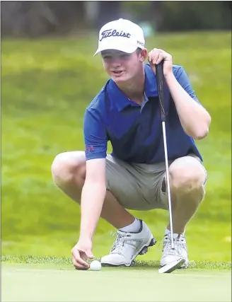  ?? PETE BANNAN — MEDIANEWS GROUP ?? Downingtow­nWest’s Nick Gross places his ball on the third green during Thursday’smatch against Downingtow­n East andWest Chester Henderson at Downingtow­n Country Club. Gross shot the low round of the day, as Ches-Mont League sports returned for the first time in six months.