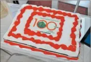  ?? LAUREN HALLIGAN — LHALLIGAN@DIGITALFIR­STMEDIA.COM ?? A cake is served on Tuesday at a celebratio­n of the YWCA of the Greater Capital Region’s 100years at its 21First St. building in downtown Troy.