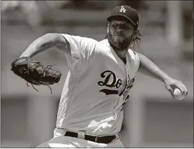  ?? ALEX GALLARDO / THE ASSOCIATED PRESS ?? Dodgers starting pitcher Clayton Kershaw throws during the first inning July 23 against the Braves in Los Angeles.