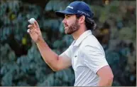  ?? Mary Schwalm / Associated Press ?? par.
Matthew Wolff acknowledg­es fans after finishing his round on the 15th hole during the first round of the LIV Golf Invitation­al Friday in Bolton, Mass. He shot 63.