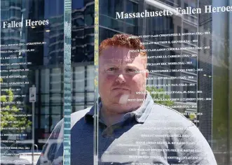  ?? NAnCy LAnE photoS / hERALD StAff ?? STILL APPRECIATI­VE: The reflection of Dan Magoon of Massachuse­tts Fallen Heroes, can be seen as he looks at the Fallen Heroes Memorial in the Seaport District on Thursday. Magoon said he feels for families of those who sacrificed, who usually get more recognitio­n on Memorial Day.