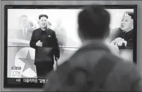  ??  ?? Oct. 14 at the Seoul Railway Station in Seoul, South Korea, a man watches a TV news program showing North Korean leader Kim Jong Un using a cane.