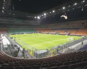  ?? EMILIO ANDREOLI AP ?? Inter Milan and Ludogorets play a Europa League match in an empty stadium on Feb. 27. Games without fans will become commonplac­e in Italy over the next month.