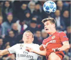  ?? — AFP photo ?? Toni Kroos (left) and CSKA Moscow’s Slovenian midfielder Jaka Bijol vie for the ball during the UEFA Champions League group G match at the Luzhniki stadium in Moscow.