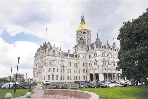  ?? Hearst Connecticu­t Media file photo ?? The state Capitol building in Hartford. A bill working its way through the legislativ­e process could increase Connecticu­t’s minimum wage to $15 by 2022.