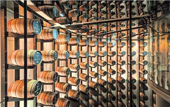  ?? ?? Whisky barrels on display in the Macallan Distillery. Stuart said the making of the casks was like being transporte­d back to ancient Egypt.