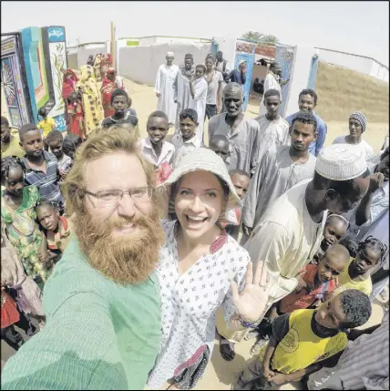  ?? SUBMITTED ?? Jon and Eva Mahoney take a selfie with a group of local residents in Dongola, Sudan, in May 2016. Jon’s beard is already eight months old.