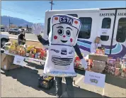  ?? Photo courtesy of the Eastern Sierra Transit Authority ?? ESTY the Eastern Sierra Transit Authority mascot at 2021 Stuff-A-Bus event at Bishop Grocery Outlet. This year’s event is coming up on Nov. 19.