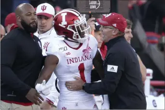  ?? NATI HARNIK — THE ASSOCIATED PRESS ?? In its first week back in the top 25after a 25-year absence, Indiana head coach Tom Allen, here talking with receiver Whop Philyor during a game with Nebraska, is eager for the challenge of traveling to Penn State Saturday.