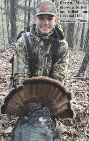  ?? ?? Dartyn Meeks shows a turkey he killed on Cavanal Hill.
Submitted Photo