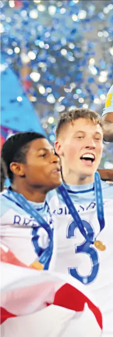  ??  ?? Golden age: Phil Foden (below) won the Golden Ball, while Angel Gomes (main image) lifted the trophy as nonplaying captain