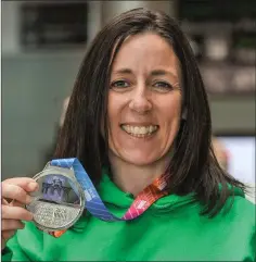  ??  ?? Irish Masters team member Ashling Smith from Slí Cualann AC with her silver medal which she won in the Womens over 40 team cross country event, during the European Masters Indoor Track & Field Championsh­ips in Madrid.