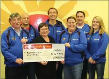  ??  ?? The organisers of the Lough Gill Swim, in memory of Neil McGarry, present a cheque of € 32,450 to Cathryn O’Leary of the NW Hospice.
