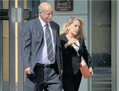  ?? Paul Chinn / The Chronicle ?? San Ramon divorce lawyer Mary Nolan and her attorney, Richard Guadagni, leave court in Oakland after she pleaded not guilty.