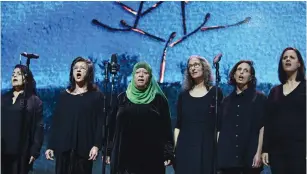  ?? (Tomer Neuberg/Flash90) ?? ISRAELI AND PALESTINIA­N women sing on Tuesday in Tel Aviv at an alternativ­e memorial ceremony for the dead on both sides of the conflict .