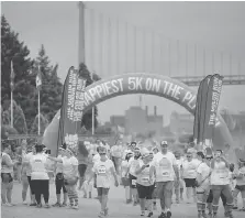  ?? DAX MELMER ?? This year’s Color Run, held on Saturday along the riverfront, benefited the Alzheimer Society of Windsor-Essex County.