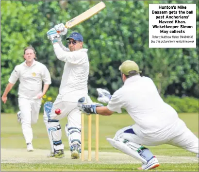  ?? Picture: Matthew Walker FM4840433 Buy this picture from kentonline.co.uk ?? Hunton’s Mike Bassam gets the ball past Anchorians’ Naveed Khan. Wicketkeep­er Simon May collects