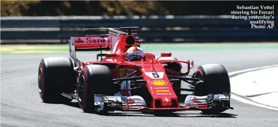  ??  ?? Sebastian Vettel steering his Ferrari during yesterday’s qualifying Photo: AP