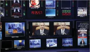  ?? (Ronen Zvulun/Reuters) ?? PRIME MINISTER Benjamin Netanyahu is seen on monitors before the evening news bulletin at Channel 10’s control room in Jerusalem.