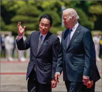  ?? (File Photo/AP/Evan Vucci) ?? U.S. President Joe Biden (right) meets with Japanese Prime Minister Fumio Kishida on May 23 at Akasaka Palace in Tokyo.