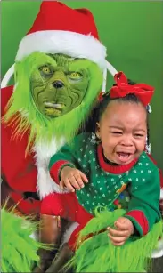  ?? Special to The Saline Courier ?? Santa and Grinchie will be stopping by Table Talk to discuss funny and heartwarmi­ng stories of taking photos with children around Christmas.