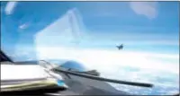  ?? ?? This screen grab from a video shows a J-16 fighter pilot from China flying in front of the nose of a US Air Force RC-135 aircraft over South China Sea.