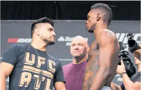  ?? Photo / Getty Images ?? Kevin Gastelum and Israel Adesanya face off at the weigh-in.