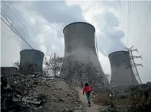  ?? PHOTO: REUTERS ?? Increased burning of coal by China, partly due to stronger growth in industrial production, is driving a rise in global carbon dioxide emissions.