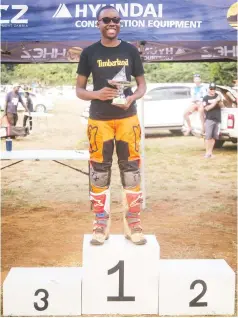  ?? ?? NUMERO UNO . . . One of Zimbabwe’s top female motocross riders Tadiwanash­e Nyamupfuku­dza is all smiles on the podium after coming first overall in the Ladies Class during the fourth round of the 2022 Zambia National Motocro ss Championsh­ip (Eureka Championsh­ips) which were held at Eureka Moto Park in Lusaka, Zambia, on Sunday